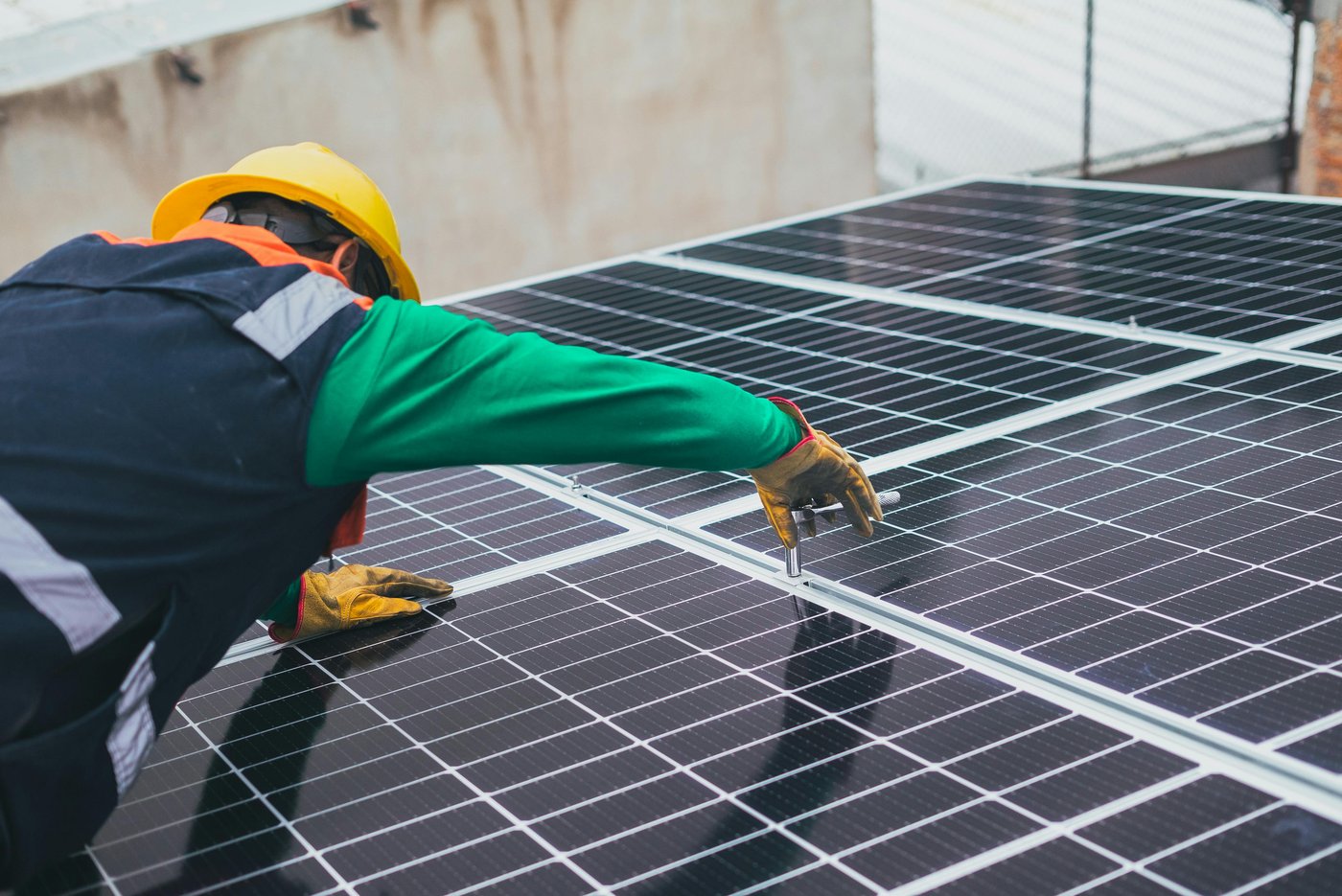 Workers installing solar panels
