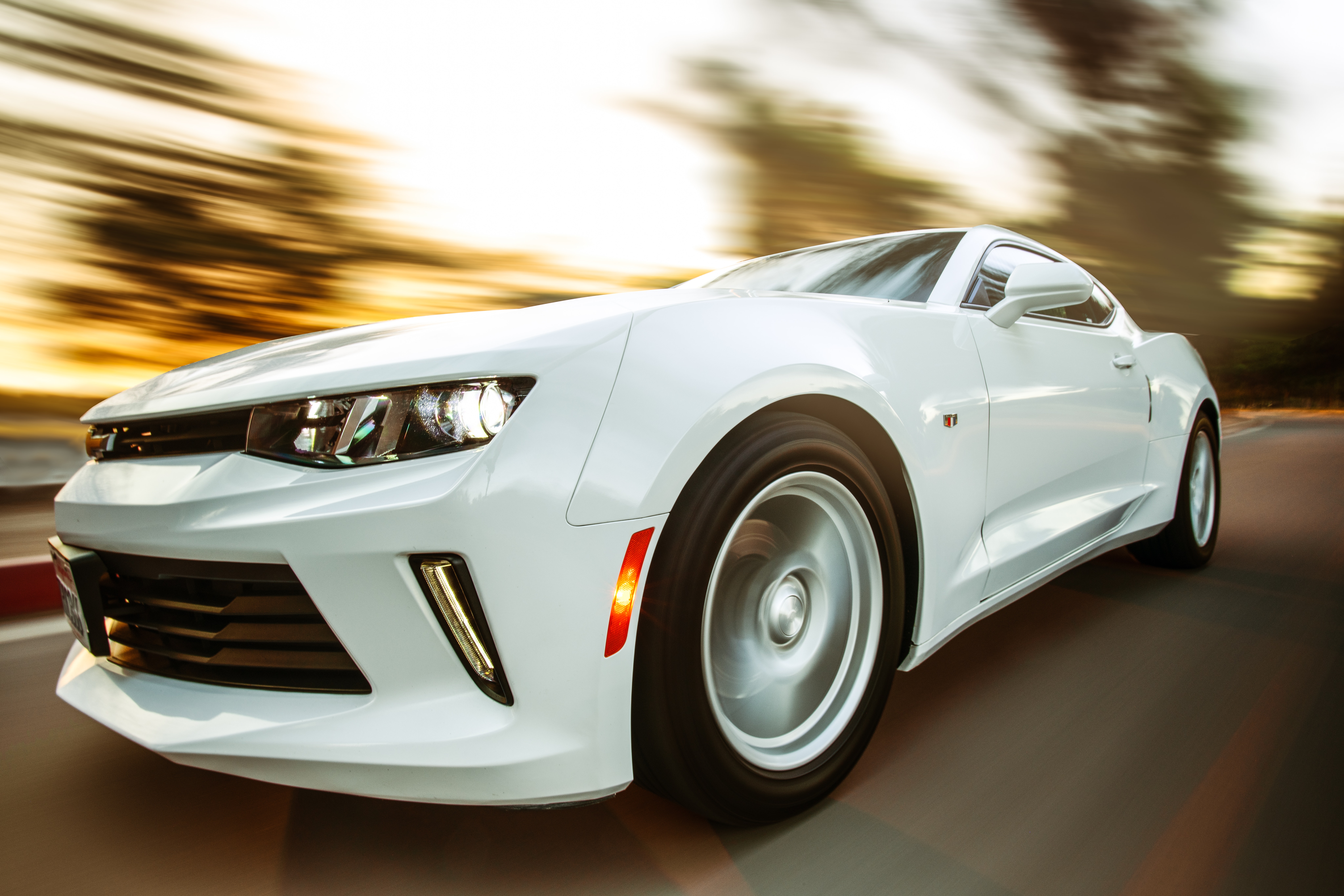 Chevrolet Camaro driving on the road