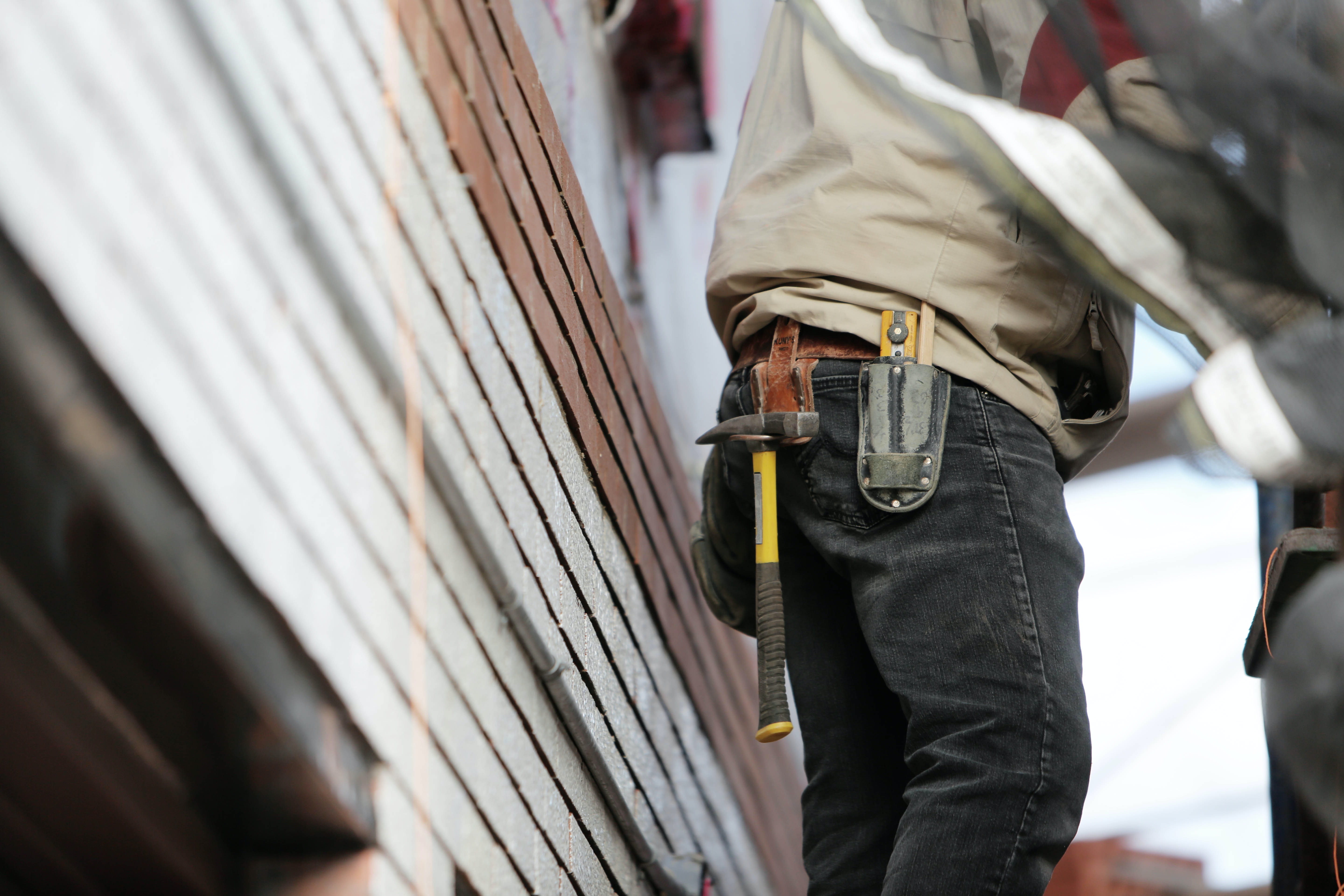 A contractor working outside a home.