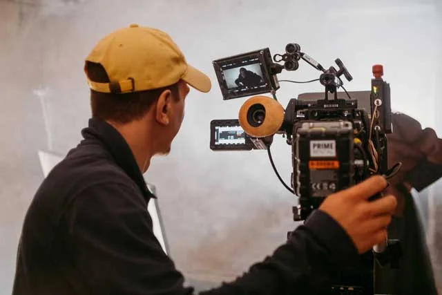 cameraman with big camera on movie set