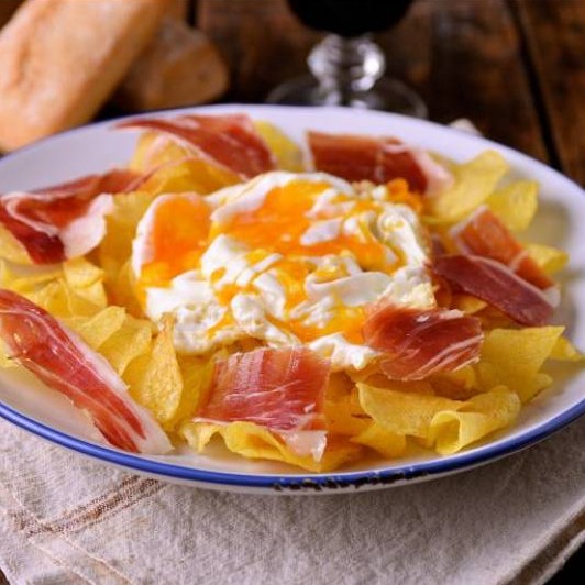 Huevos rotos with jamon