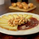 The perfecft plate of Jamón Iberico de Bellota and Manchgego cheese with Picos camperos and marcona almonds