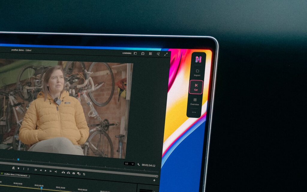Nice Touch 7 Nice Touch's compact assistant beside a Premiere Pro interview preview and timeline on a laptop