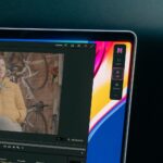 Nice Touch 1 Nice Touch's compact assistant beside a Premiere Pro interview preview and timeline on a laptop