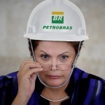 Dilma e capacete Petrobras. Imagem blog Feijoada Política.