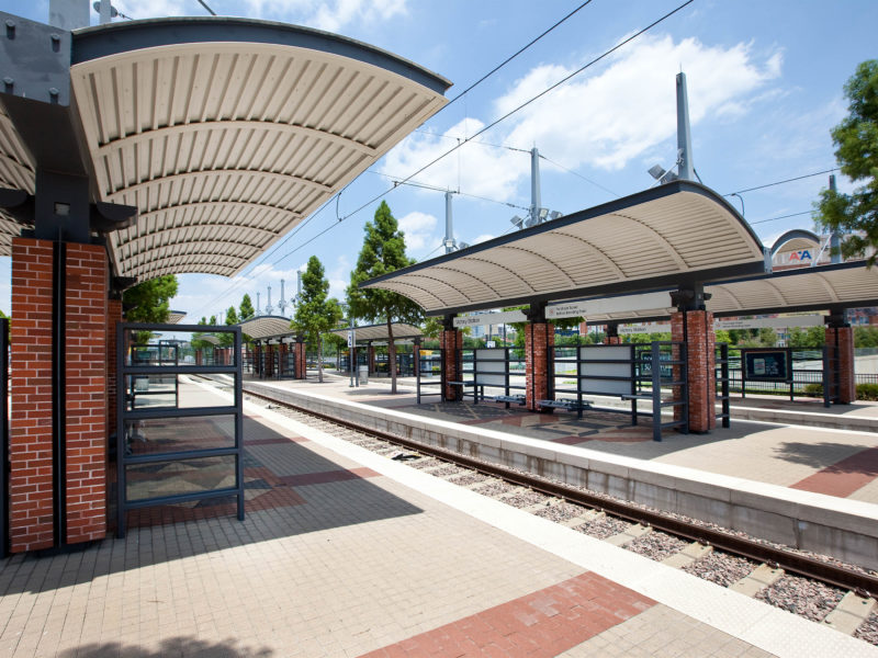 Side view of train rails and canopied stops at the Victory Station
