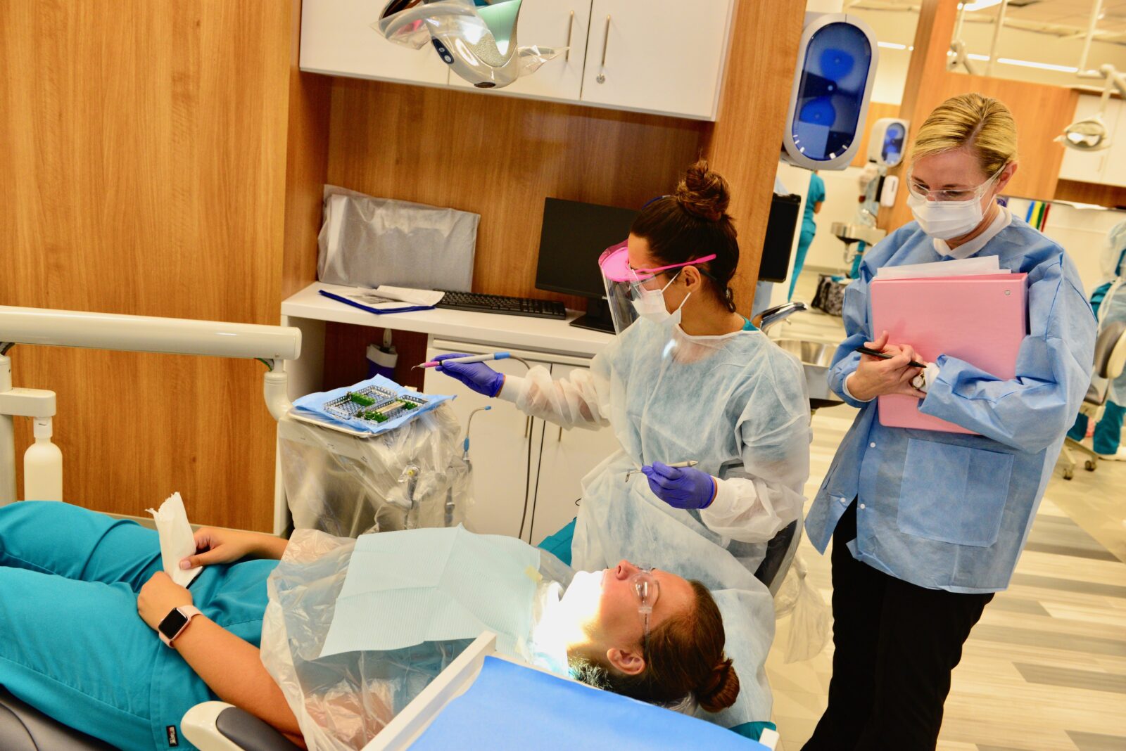 Student and instructor practicing dental services in new STLCC dental clinic