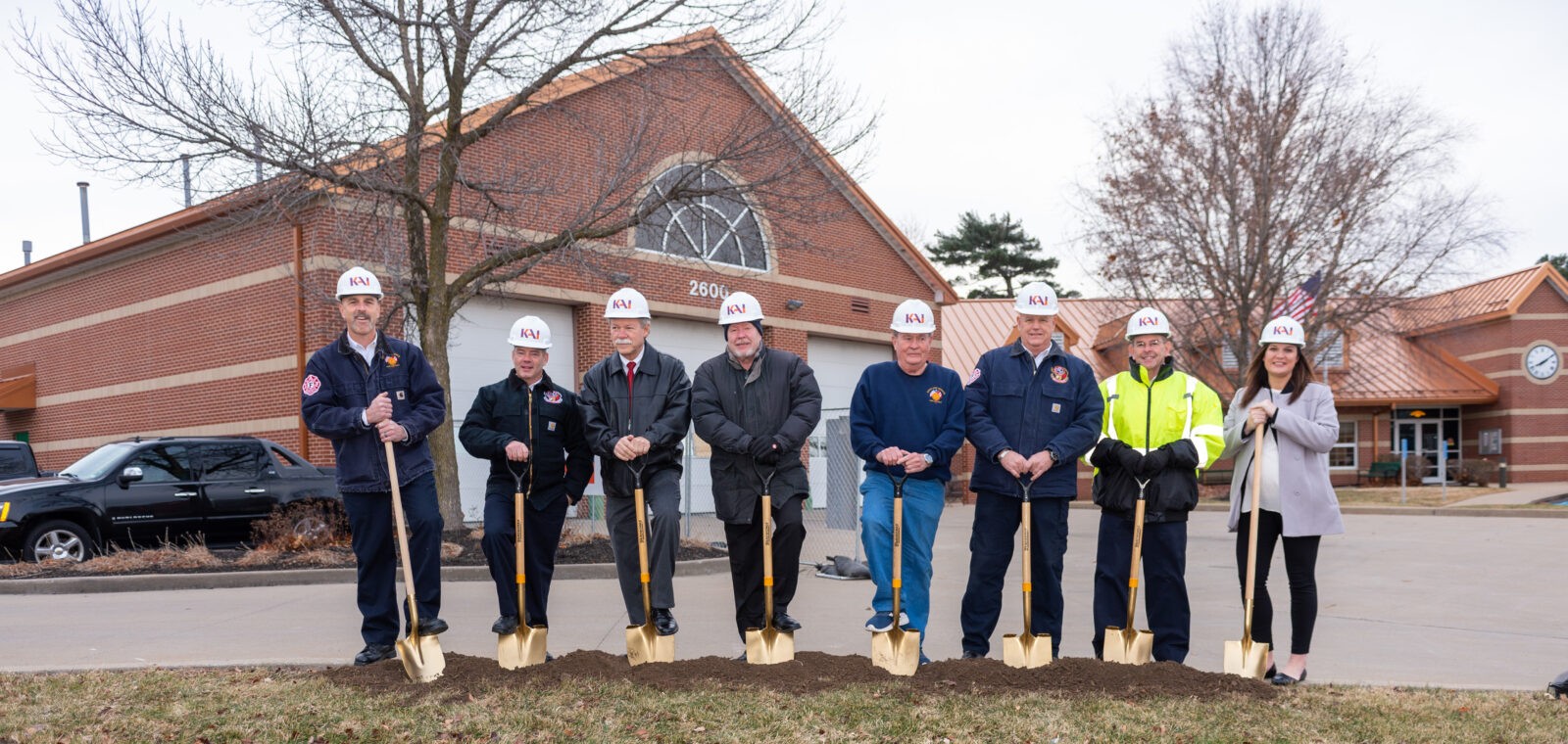 Maryland Heights Fire Protection District Headquarters Engine House One groundbreaking event 8 people with shovels and KAI hard hats