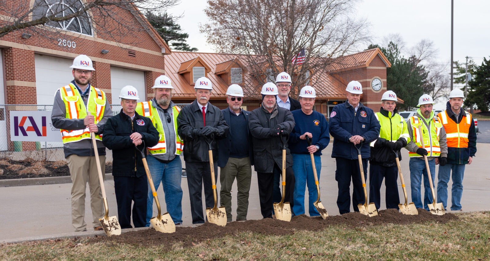 Maryland Heights Fire Protection District Headquarters Engine House One groundbreaking event 11 men with shovels and KAI hard hats