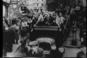 Nazi brown shirts ride in open truck through Berlin