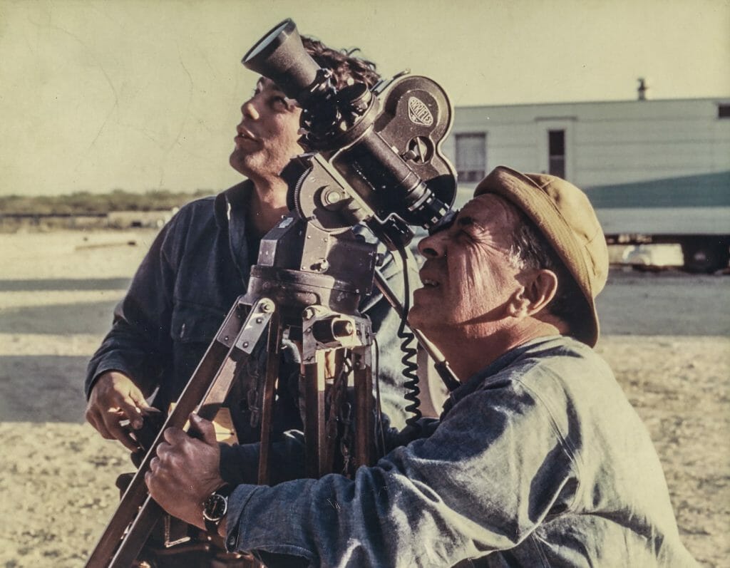 Two men filming with 16mm movie camera