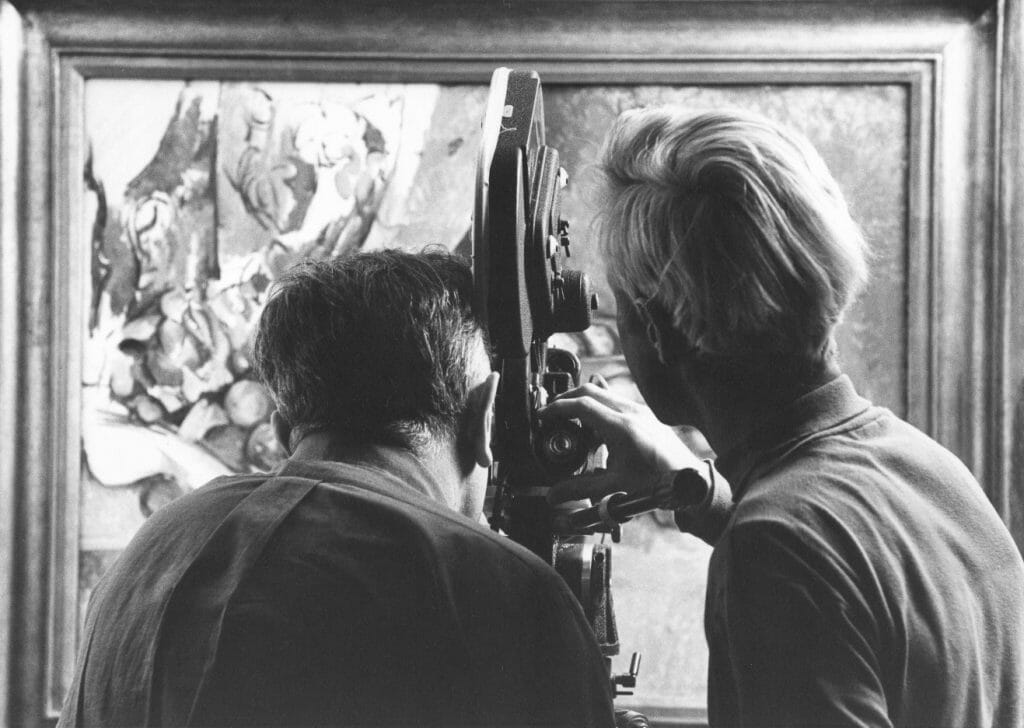 two men, backs to camera, film painting