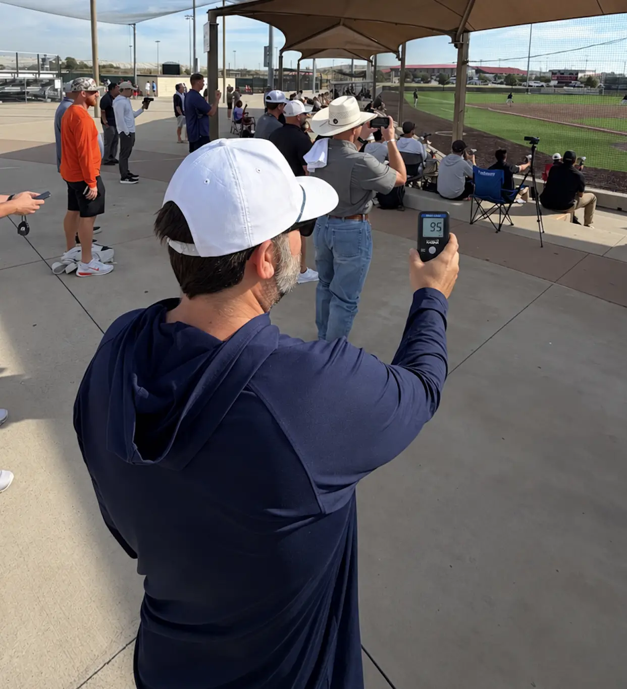 Dustin McComas holding a Pocket Radar
