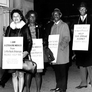 A photo of four black workers who are holding signs while on strike in Little Rock, Arkansas.