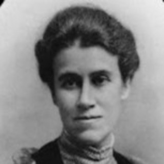 A grayscale photograph portrait of Helen Bosanquet. Her hair is dark and pinned up and back. She is wearing a turtleneck dress (or shirt, I am not sure). She is looking slightly off to the left of the camera. Photo Credits: unknown, Photo Source: Wikimedia Commons. 