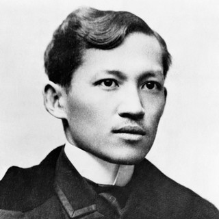 A grayscale photo portrait of Jose Rizal. He is wearing a suit jacket and looking intensely, yet excitedly to the right of the camera. Photo Credit: Alonso Realonda (1890s). Photo Source: Wikimedia Commons.
