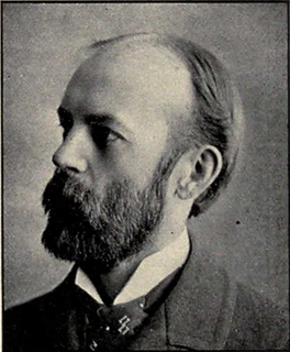 A black-and-white photograph of Charles Cooley. He is wearing an old-fashioned looking suit, he has a full, mid-length beard, and thinning dark hair. He is looking off to the left of the photo. Photo Credit: Unknown photgrapher, 1902, from commons.wikimedia.org