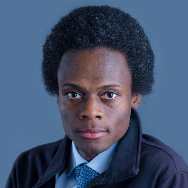 A headshot of Rodney Kimbangu, looking directly at the camera.