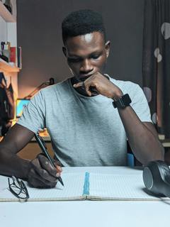 Photo by Oladimeji Ajegbile: https://www.pexels.com/photo/photo-of-man-writing-on-notebook-2989397/