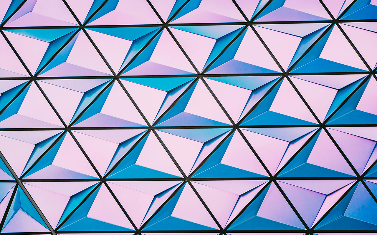 Triangular geometric pattern in shades of blue and purple.