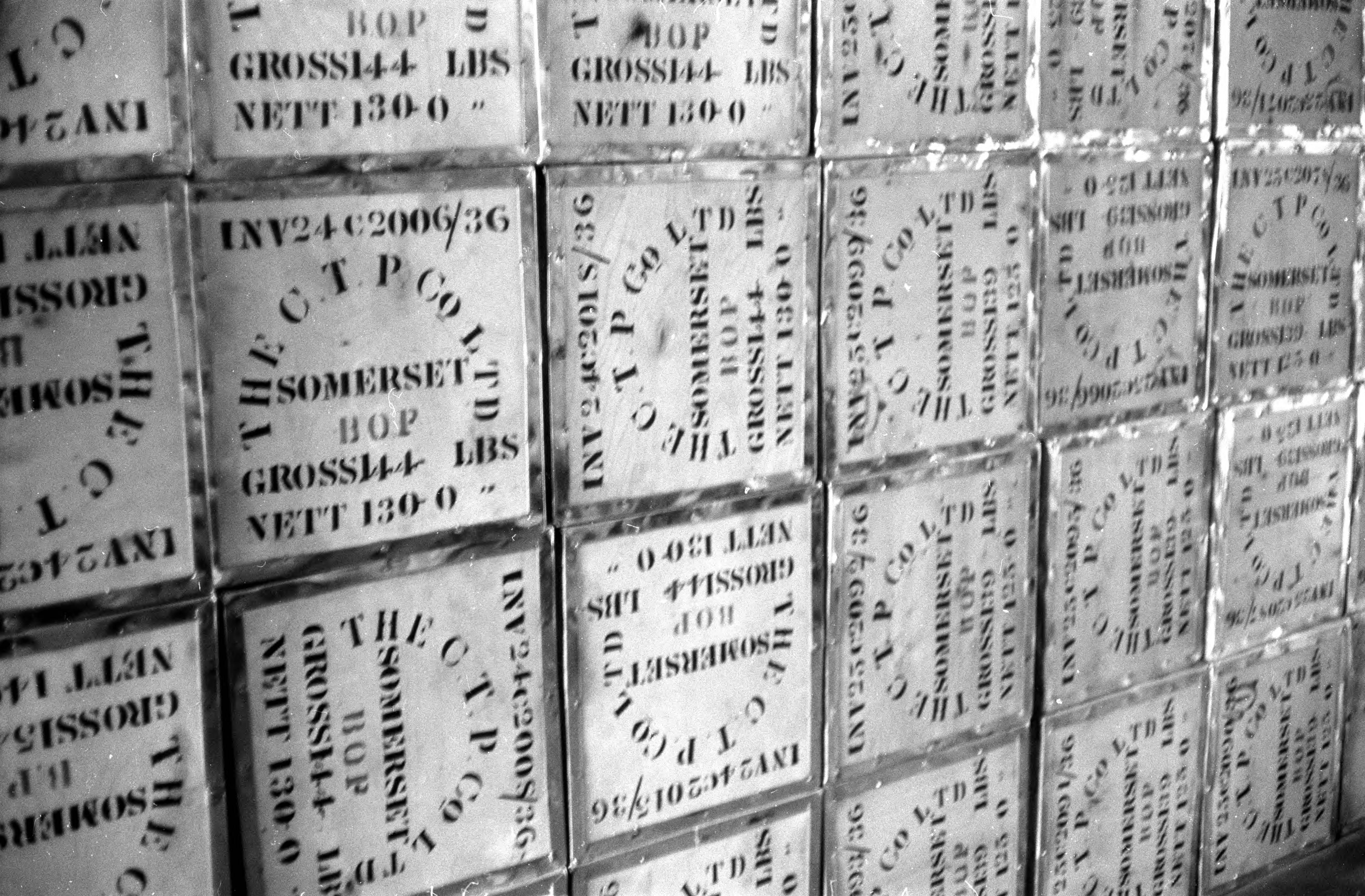 The front of boxes are visible in a large stack, each box with information written on them including "Somerset."
