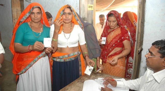 Women voting in a village in India