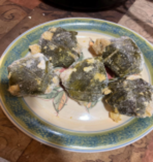 A plate of Tamales de ceniza, tamal made with corn cooked with ashes and wrapped in corn fresh leaves