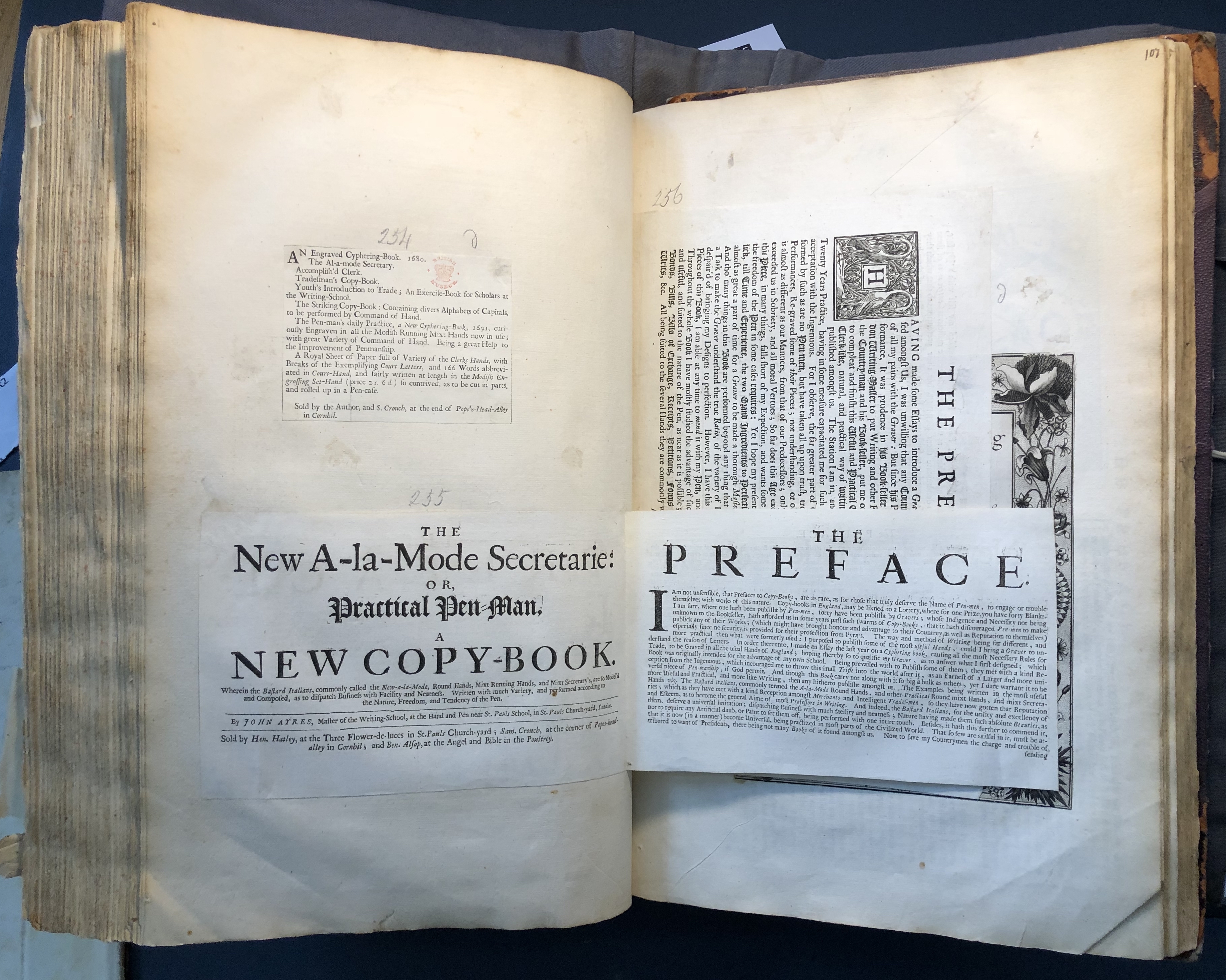 Photograph of copybooks pasted into an album assembled by John Bagford