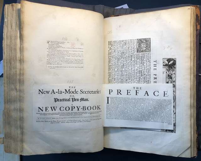 Photograph of copybooks pasted into an album assembled by John Bagford