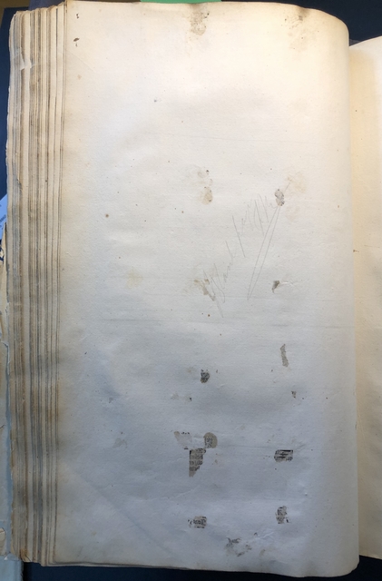 Photograph of a page showing evidence of a fragment being removed