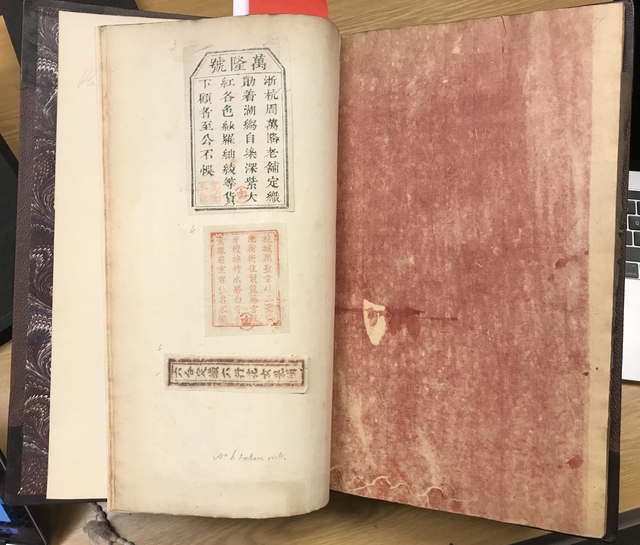 Photograph of specimens of Chinese printing pasted into a large volume of specimens