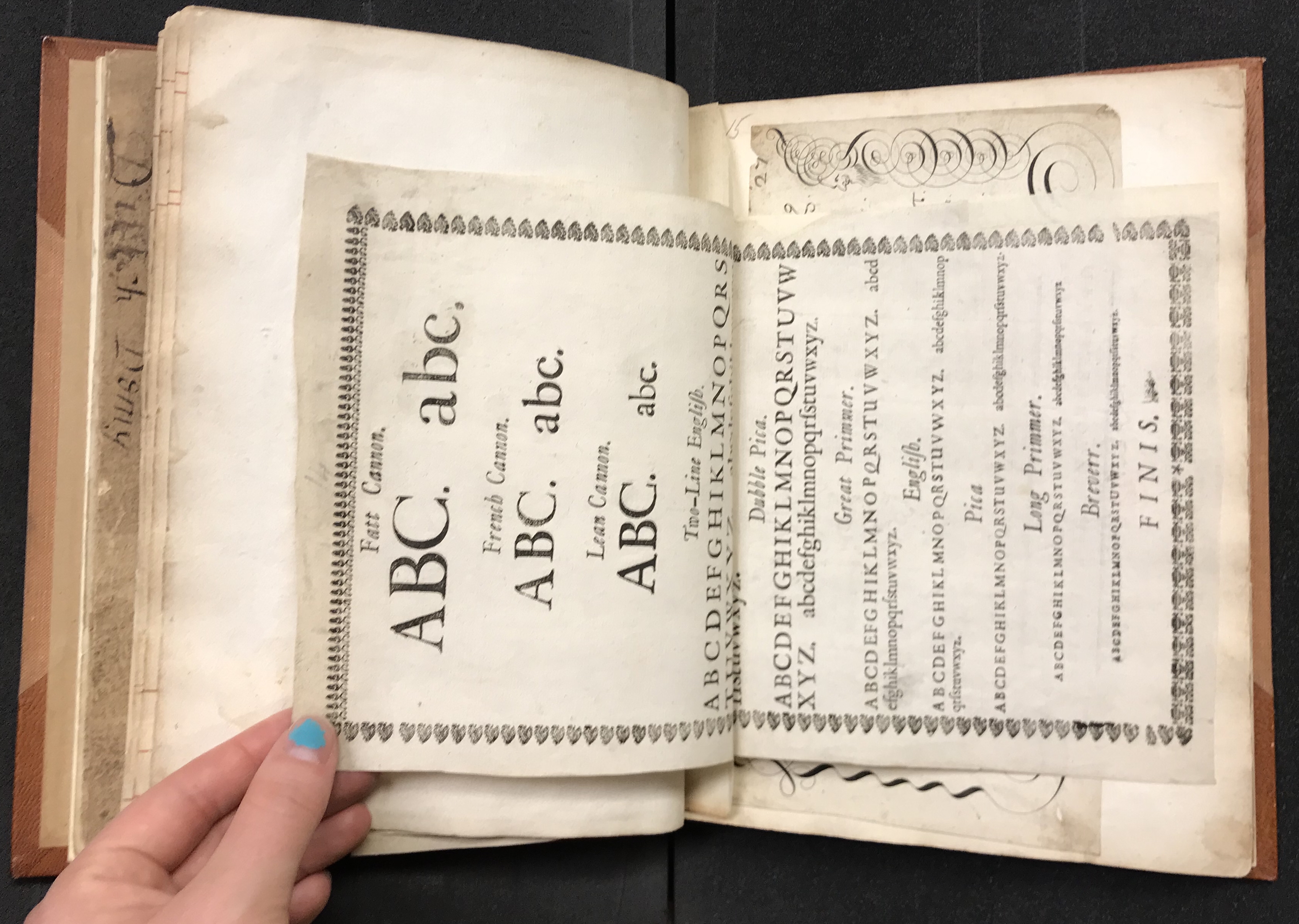 Photograph of calligraphy specimens pasted into a large volume of specimens