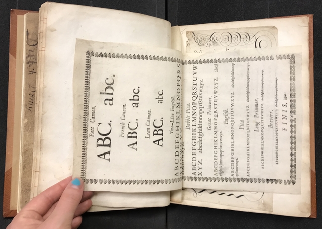 Photograph of calligraphy specimens pasted into a large volume of specimens