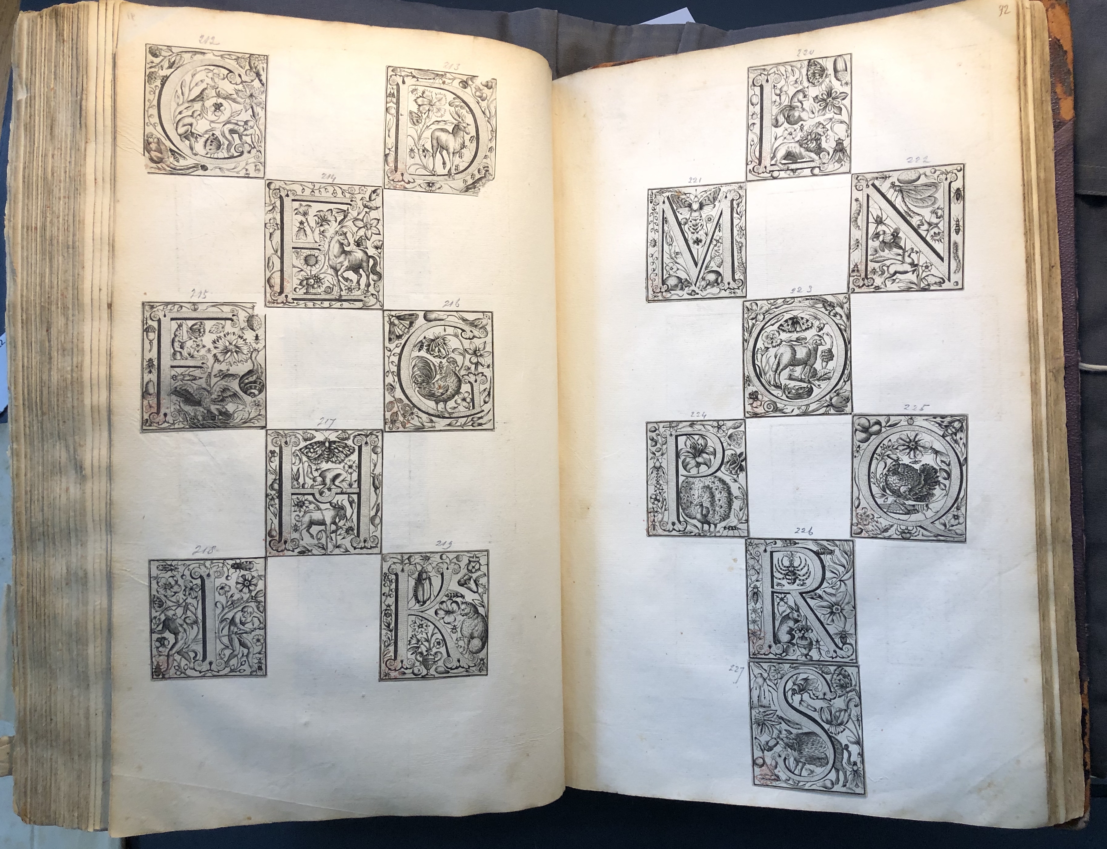 Photograph of printed initials pasted into an album assembled by John Bagford