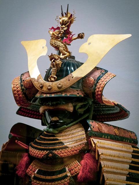 Photo of gold, green, and red Samurai armor