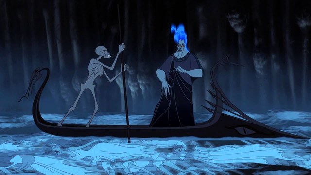 In the image, there is a figure of Hades and Charon. Hades is blue with a slim face, jagged sharp teeth, tall, has blue fire hair, toga, and and has yellow piercing eyes. Charon is a skeleton with a prominent jaw like an underbite and is holding a stick to paddle the slim boat. The boat is black and is pointed at the tip where there is an eyeball shape and the other end has a sharp tail. Both figures are in the boat paddling across souls that are luminescent blue. They are surrounded by a carved rigid cave structure.  