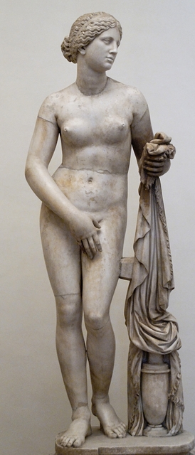 Nude statue  of the Goddess Aphrodite showing her reaching for her towel while covering her pubic area leaving her breasts exposed.
