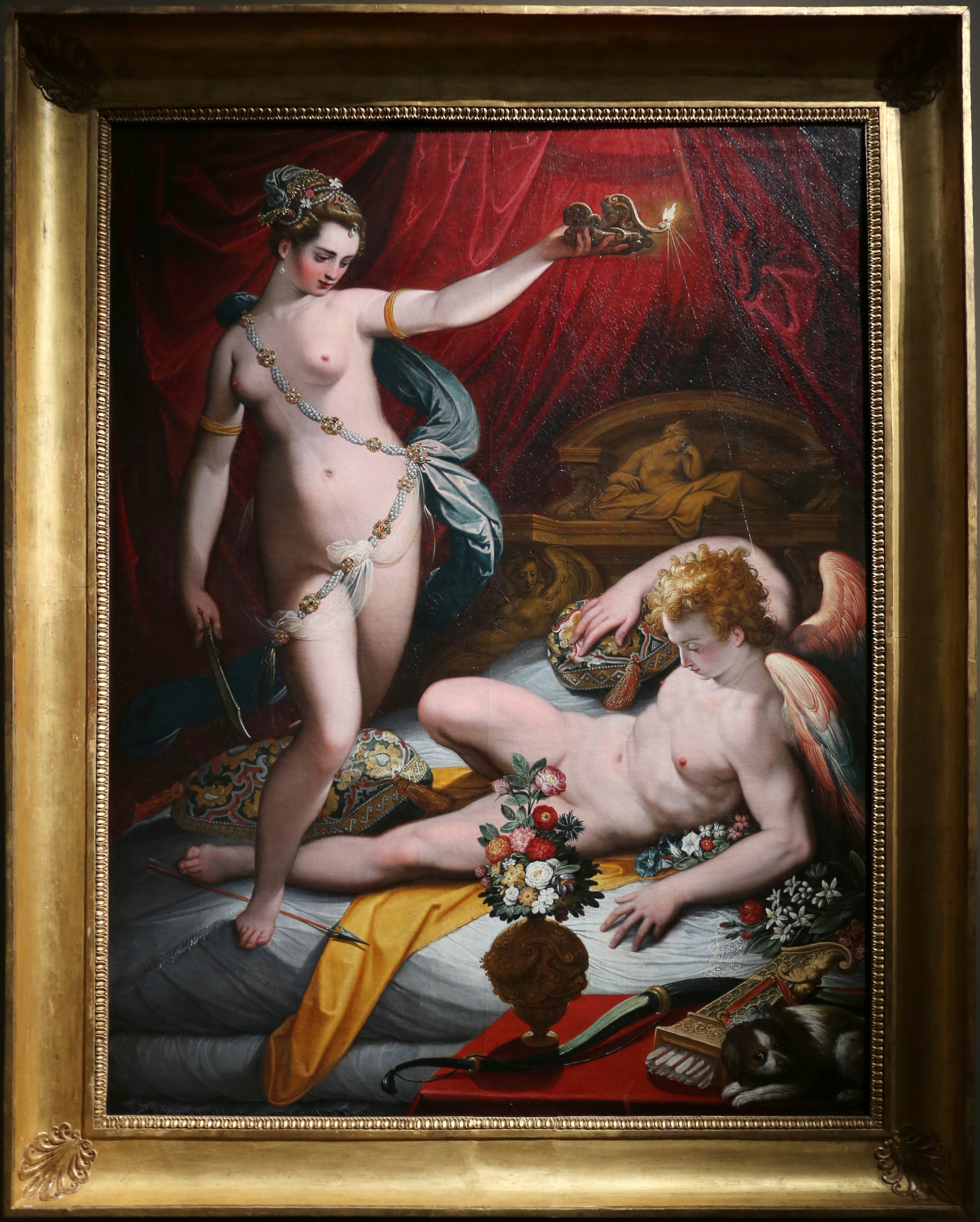 This painting depicts Psyche finding out her husband is Cupid, to her surprise. As a result, hot oil from her lamp falls on Cupid, waking him up.