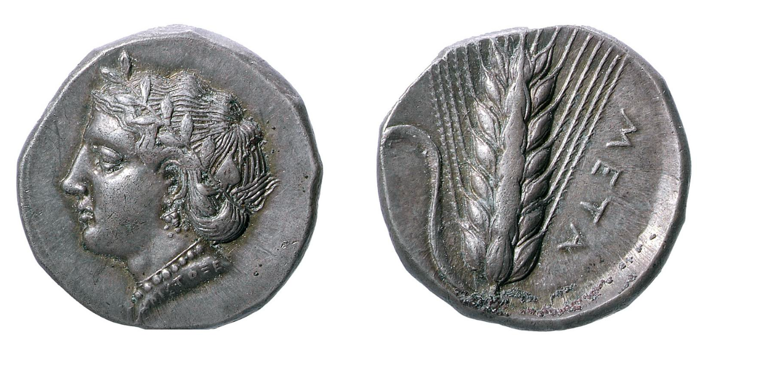 The following are two sides of the same Greek coin created around 400BC-340BC in Greece. On the front side is the Head of Demeter herself and on the reverse side is Barley-ear with a leaf. This is a fitting symbol as Demeter is the goddess of Agriculture and Barley-ear is a good representation of agriculture.