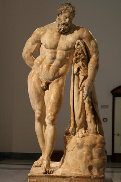 Marble statue of a muscular, bearded man, Hercules, standing in a contrapposto pose. He leans tiredly on a club draped with a lion skin. His body shows exaggerated musculature, and he gazes downward with a weary expression.