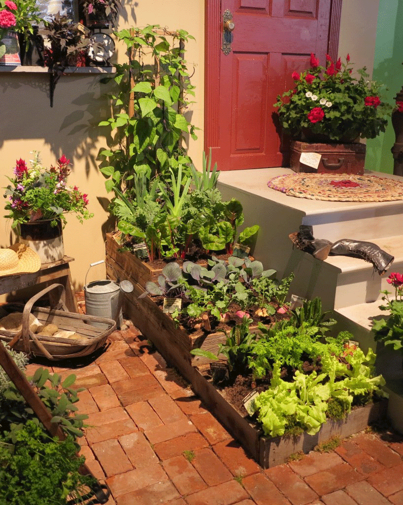 Three stacked raised beds hold a selection of vegetables — a display garden at the 2016 Philadelphia Flower Show.