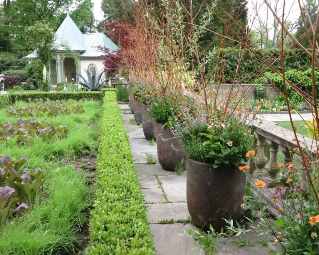 Rows of identically planted pots link two distinct planting areas at Chanticleer Garden in Pennsylvania. (Garden Making photo)