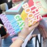 A colorful book held in someone's hands
