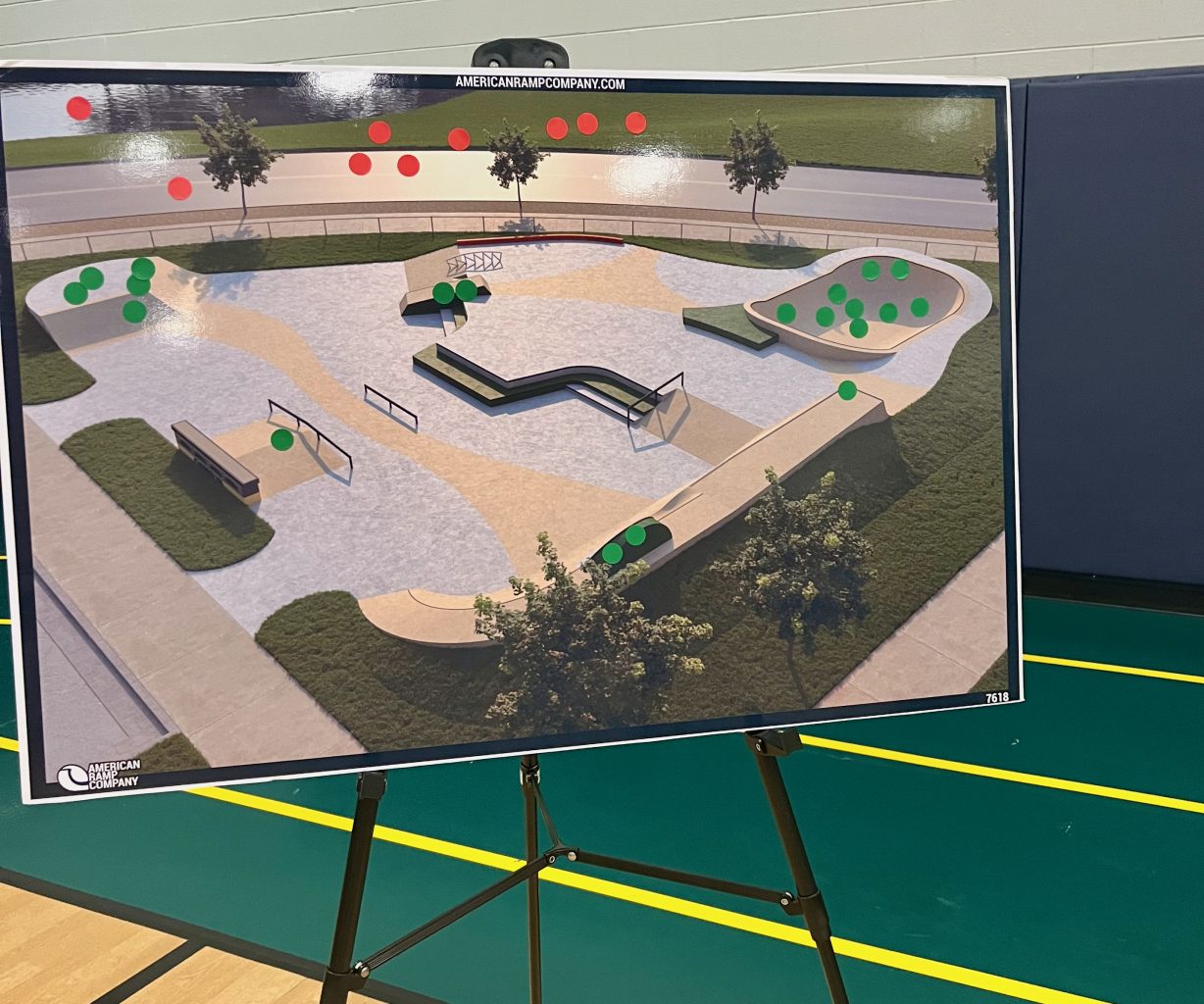 A drawing of a new skate park has clusters of green and red stickers