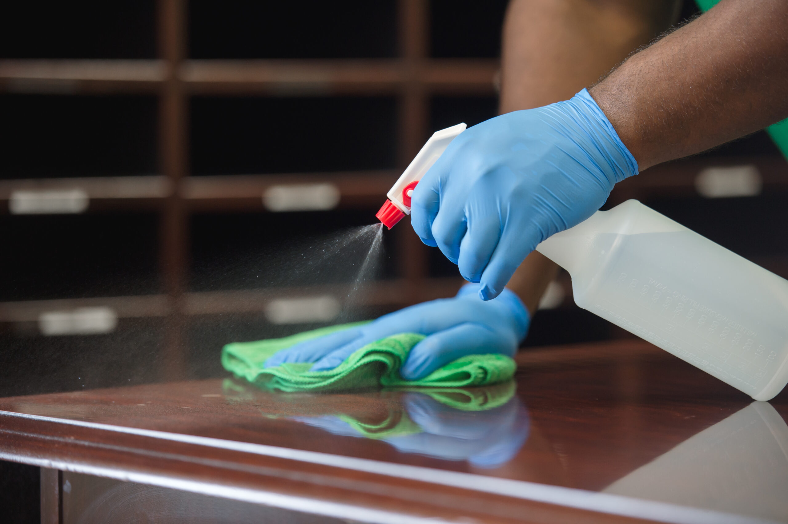 professional cleaning of office desk surface area