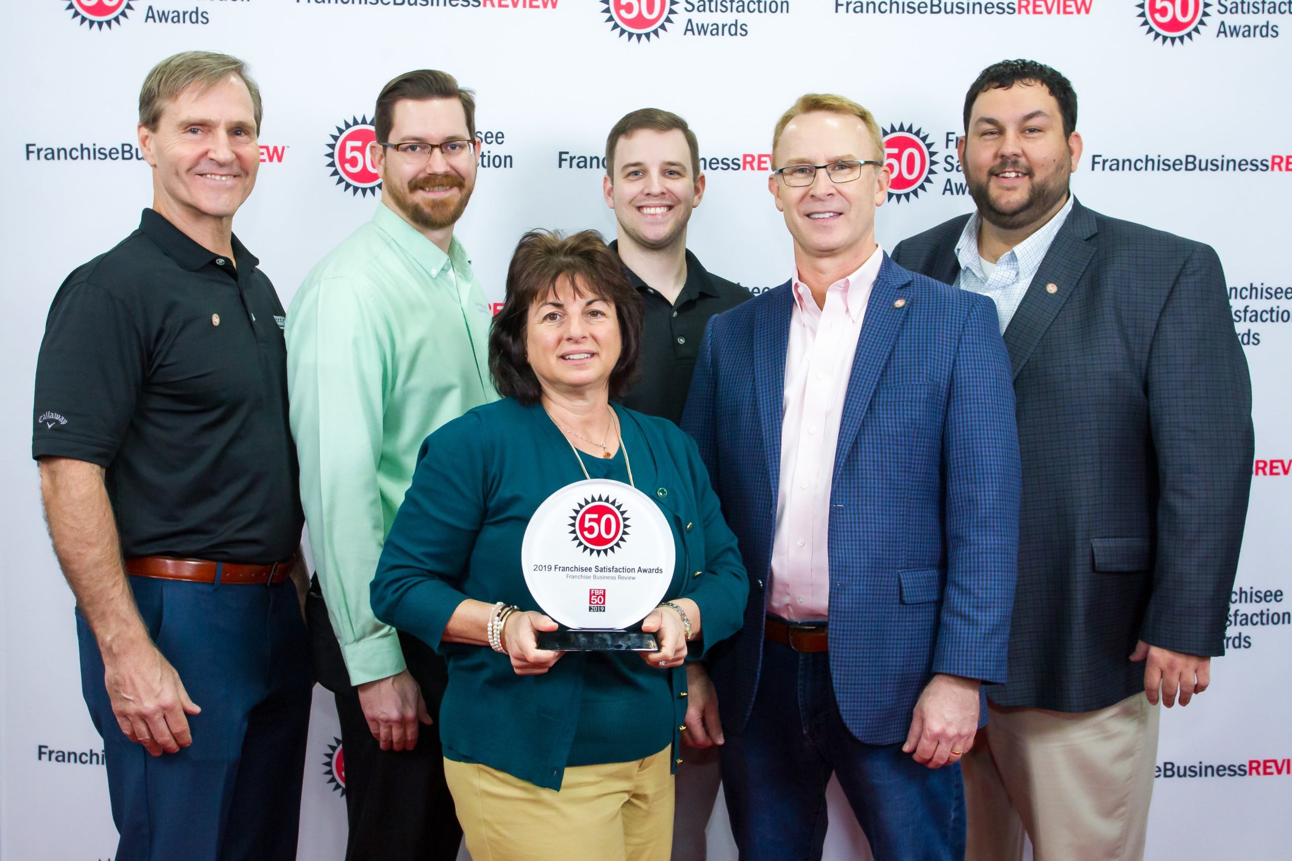 Office pride executives receiving franchise award
