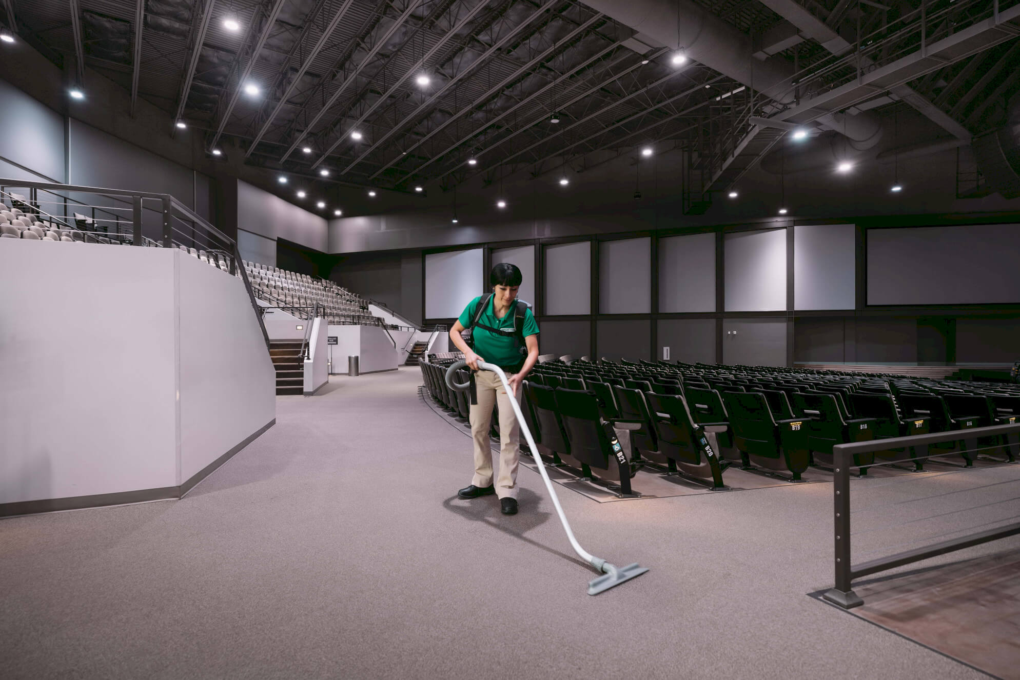 professional cleaner cleans a auditorium room