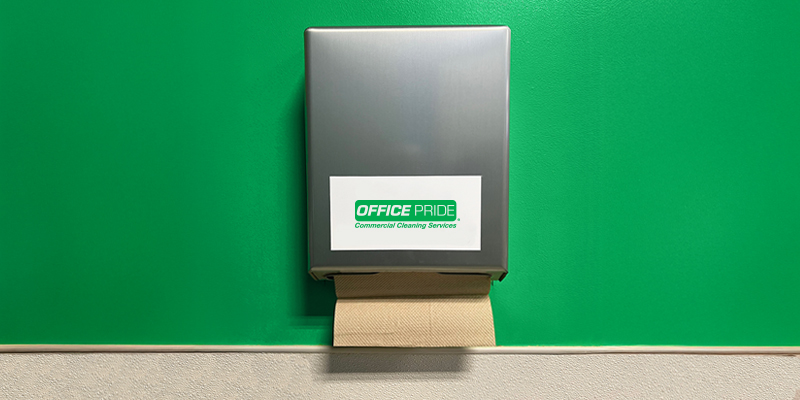 Paper towel dispenser with the Office Pride logo displayed on the front.