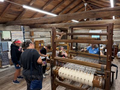 Sauder Village 2026 - Weaving demonstration on the loom