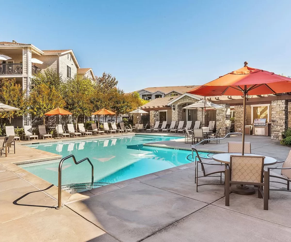 Pool amenity area at furnished corporate apartment building located in Santa Rosa, CA.